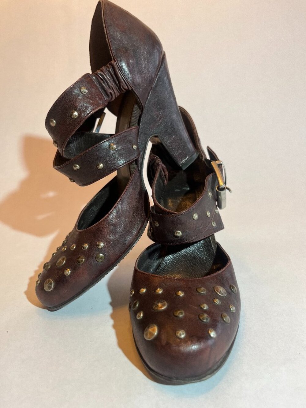 typeZ brown leather heels with studds